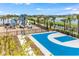 Community playground and basketball court near a lake at 732 Ocean Spray Dr, Ruskin, FL 33570