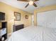 Charming bedroom with a double bed, ceiling fan, and lots of closet space at 7436 Baltusrol Dr, New Port Richey, FL 34654