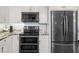 Stainless steel kitchen appliances including a built-in microwave at 7436 Baltusrol Dr, New Port Richey, FL 34654