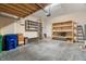 Organized garage space featuring ample shelving, storage, and a clean concrete floor at 7602 S Desoto St, Tampa, FL 33616