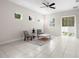 Relaxing living room featuring tiled floors and sliding glass doors at 7602 S Desoto St, Tampa, FL 33616