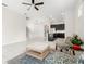 Bright, open-concept living room featuring tile flooring, contemporary furnishings, and seamless flow into kitchen at 7602 S Desoto St, Tampa, FL 33616