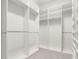 Spacious walk-in closet with ample shelving and hanging rods at 7602 S Desoto St, Tampa, FL 33616