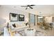 Living room with white couch and yellow throw pillows at 761 Steel Dr, Apollo Beach, FL 33572