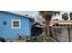 Side yard with shed and patio furniture at 7623 Gulf Blvd, St Pete Beach, FL 33706