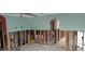 Under construction living room with exposed framing at 7623 Gulf Blvd, St Pete Beach, FL 33706