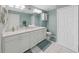 Double vanity bathroom with updated fixtures and a large mirror at 8229 Eagles Park N Dr, St Petersburg, FL 33709