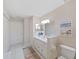 Bright bathroom with updated fixtures and tile floors at 8229 Eagles Park N Dr, St Petersburg, FL 33709