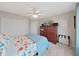 Bright bedroom with a queen bed and built-in entertainment center at 8229 Eagles Park N Dr, St Petersburg, FL 33709