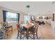 Bright dining room with a wooden table and six chairs at 8229 Eagles Park N Dr, St Petersburg, FL 33709