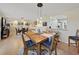 Bright dining room with a wooden table and six chairs at 8229 Eagles Park N Dr, St Petersburg, FL 33709