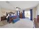 Large main bedroom with king-size bed and access to balcony at 8229 Eagles Park N Dr, St Petersburg, FL 33709