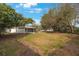 Large backyard with mature trees and grassy area at 8419 Quarter Horse Dr, Riverview, FL 33578