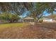 Spacious backyard with screened patio and mature trees at 8419 Quarter Horse Dr, Riverview, FL 33578