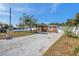 House exterior showcasing a front yard and driveway at 8510 River Oaks Dr, Tampa, FL 33615