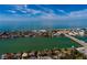 Aerial view highlighting home's waterfront location and proximity to beach at 9320 Gulf Blvd, St Pete Beach, FL 33706