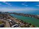 Aerial view highlighting home's waterfront location with city and ocean views at 9320 Gulf Blvd, St Pete Beach, FL 33706