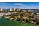 Aerial view of house near the waterfront with a private dock, and a community park nearby at 9320 Gulf Blvd, St Pete Beach, FL 33706