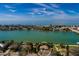 Aerial view of a waterfront home with access to the ocean and city views at 9320 Gulf Blvd, St Pete Beach, FL 33706