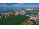 Aerial view showcasing home's waterfront location with city and ocean views at 9320 Gulf Blvd, St Pete Beach, FL 33706