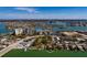 Aerial view showing home's location near waterfront with city views in background at 9320 Gulf Blvd, St Pete Beach, FL 33706