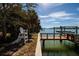 Waterfront property with private dock and lush landscaping at 9320 Gulf Blvd, St Pete Beach, FL 33706