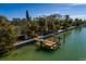 A private wooden dock with lift providing direct water access at 9320 Gulf Blvd, St Pete Beach, FL 33706