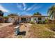 Single story home with brick driveway and mature landscaping at 9320 Gulf Blvd, St Pete Beach, FL 33706