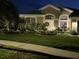 Well-maintained home with landscaped yard and festive lighting at 10919 Australian Pine Dr, Riverview, FL 33579