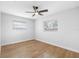 Bright bedroom with hardwood floors and ceiling fan at 11119 N 21St St, Tampa, FL 33612