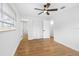 Bright bedroom with wood floors and ceiling fan at 11119 N 21St St, Tampa, FL 33612