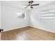 Well lit bedroom with wood floors and window at 11119 N 21St St, Tampa, FL 33612