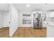 Eat-in kitchen with stainless steel refrigerator and hardwood floors at 11119 N 21St St, Tampa, FL 33612