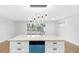 Modern kitchen with island and blue dishwasher at 11119 N 21St St, Tampa, FL 33612