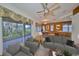 Spacious living room with hardwood floors, a view of the backyard, and a neutral color scheme at 1123 Emerald Dunes Dr, Sun City Center, FL 33573