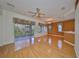 Large living room with hardwood floors and access to a patio at 1123 Emerald Dunes Dr, Sun City Center, FL 33573