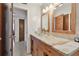 Bright bathroom with granite countertop and glass vessel sink at 11388 77Th Ave, Seminole, FL 33772