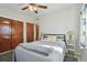 Spacious bedroom with double bed and mirrored closet doors at 11388 77Th Ave, Seminole, FL 33772