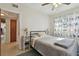 Bright bedroom with double bed and access to hallway at 11388 77Th Ave, Seminole, FL 33772