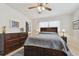 Bedroom with a full-size bed, dresser, and ceiling fan at 11388 77Th Ave, Seminole, FL 33772