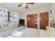 Bedroom featuring a double bed, TV, and bird-themed curtains at 11388 77Th Ave, Seminole, FL 33772