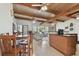 Open concept dining area with kitchen island and living room view at 11388 77Th Ave, Seminole, FL 33772