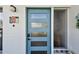 Modern teal front door adds curb appeal at 11388 77Th Ave, Seminole, FL 33772