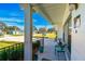 Relaxing front porch with sitting area and street view at 11388 77Th Ave, Seminole, FL 33772