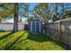 Grey storage shed in grassy backyard at 11388 77Th Ave, Seminole, FL 33772