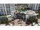 Aerial view of luxury towers with a pool, lush landscaping, and convenient parking at 1209 E Cumberland Ave # 505, Tampa, FL 33602