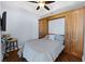 Cozy bedroom featuring a Murphy bed with built-in storage cabinets and drawers at 1209 E Cumberland Ave # 505, Tampa, FL 33602