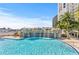 A luxurious pool with a waterfall feature and clear blue water, inviting relaxation at 1209 E Cumberland Ave # 505, Tampa, FL 33602