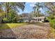 Inviting backyard oasis featuring a sparkling pool and ample patio space at 12717 Carte Dr, Tampa, FL 33618