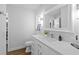 Modern bathroom with white cabinets and a quartz countertop at 12717 Carte Dr, Tampa, FL 33618